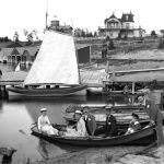 In the earliest days, the easiest way for Belvedere resorters to reach downtown was by boat. Both the Belvedere and the Chicago Club across the upper channel petitioned the city for their own dock space, since the existing wharves and docks were too high. So the city designated the Clinton Street dock for the exclusive use of the resorters and built lower facilities for them. Every summer Sunday morning, a flotilla of boats left from the clubs to cross Round Lake, everyone dressed in their Sunday best as they headed for church. Here, a party prepares to shove off from the Belvedere Bayou. Belvedere Bayou