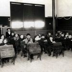 As Charlevoix grew, pressure on the fourth school prompted the construction in 1895 of two smaller elementary (K-4) schools on either side of town. The Washington School stood at the northeast corner of Burns Street and Petoskey Avenue on the north side, and the Lincoln School was on East Garfield near Bridge Street on the south, now the American Legion hall. Here, kindergartners through second graders pose in the Washington School around 1912. Washington School 1912