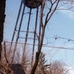 The 1906 water tower was a major landmark that could be seen for miles both from Lake Michigan and inland. It had aged drastically by the mid 1990s, by which time a replacement had already been put up on Division Street near the municipal golf course. Although considered by some to be a candidate for a terrific observation tower, projected renovation, maintenance, and insurance costs proved to be prohibitive. Its legs were torched almost through, then cables pulled it over in a few throat-catching seconds in May of 1995 Water Tower