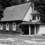 Charlevoix’s churches may be said to have begun with the Greensky Hill Indian Mission Church located about three miles northeast of town. The first meetings here were held in what the Native Americans called a “Wag-nog-ang,” a small bark structure with a dirt floor. A growing congregation necessitated a larger church. Started in 1851 and finished ten years later, it was built of hand-hewn white pine logs notched and secured using no nails or metal of any kind. Today, hymns, even Christmas carols, are occasionally sung in the Ojibwe/Odawa language Greensky Hill Indian Mission Church