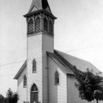 Charlevoix received its Catholic Church in 1889 on south Bridge Street. The sanctuary was blessed on May 31, 1894. In November of that year, the church bell was dedicated in a solemn ceremony. It weighed 521 pounds, and was secured through the efforts of James Gellick, owner of the local saloon, as a memorial to his deceased daughter Gracie. Her name appeared in raised letters upon the bell’s surface. The present church, just to the south of this one, was constructed in 1964, and old St. Mary’s came down. Catholic Church