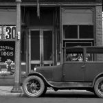 Martha Ayers was an eccentric but shrewd businesswoman who arrived in Charlevoix in the early 1890s. She erected the largest building downtown, called after herself, that housed a saloon, billiards parlor, and dance hall. In the 1920s a restaurant occupied the south half of the street floor, where its window proclaimed a delicacy of the local cuisine. Martha Ayers around 1920