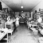 The interior of Jacobs’ grocery at 205 Bridge Street around 1932, where the Sherwood store once was. From left: Henry Jacobs, unidentified, Flossie Fox, and Earl Johnson. For many years this was the site of the Polly Kay Shop for women’s and children’s clothing, then the Shop of the Gulls fine gift store. Jacob's Grocery