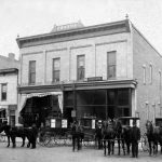 Horace S. Harsha’s building in the middle of the 200 block next to the alley, completed in the summer of 1898. This became the van Pelt building in 1910 after Mr. van Pelt of Norwood bought it and remodeled the façade. On the left is Mrs. Levinson’s dry goods store, soon to occupy the whole first floor after her son Meyer took over. On the right is one of the many sites of the Post Office, with rural delivery wagons in front. The Charlevoix Courier, the town’s second newspaper, occupied the basement when this photo was taken. Horace S. Harsha’s building