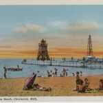 Postcard from Charlevoix illustrating fun on Lake Michigan Beach, in addition to showing the South Pier Lighthouse and light on North Pier. Photograph is property of the Charlevoix Historical Society.