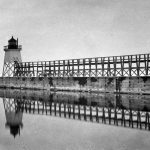The first lighthouse in Charlevoix was on the North Pier. The box on the right side of the phonograph was used for storing lantern oil. Photo ca. 1890. Photograph is property of the Charlevoix Historical Society.