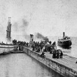 On the night of June 16, 1887 the passenger steamer Champlain burned and ran aground off Fisherman’s Island with a known loss of twenty-two lives. Thought to be the result of a fallen lantern in a cabin, the fire broke out shortly before midnight. The wooden boat went up in a flash. Her captain raced for land so fast there was no way to lower the lifeboats. Passengers and crew went overboard, clinging to each other and anything they could find. The smoldering hull was towed to the south pier the next day. It was the worst maritime disaster in Charlevoix’s history. The vessel was rebuilt as the City of Charlevoix. Chaplain