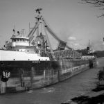 In the late 1950s a rural electric plant was constructed near Boyne City at the end of Lake Charlevoix. It required thousands of tons of coal. Lake freighters began to pass through Charlevoix on a regular basis eight to thirteen times a year. Traffic on Bridge Street could freeze for half an hour or more. On busy summer days the lines of cars might stretch half a mile or more on both sides of town. The Hennepin was named after the French priest who accompanied LaSalle on his explorations of New France in the late 1600s. Father Charlevoix gave him prominent mention in his journals The Hennepin