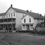 The Fountain City House was often the first stop for the region’s settlers. Newspaperman Willard Smith lived there after he arrived in 1869 to get the Sentinel up and running next door. He remembered that “ . . . in the center (of the hotel office) was a large box stove. On the winter evenings as we played euchre and sometimes ‘penny ante,’ a line of socks surrounded the big stove from which arose a perfume that today would drive every guest from the house. We had but one ‘Resorter’ and he was a delirium tremens subject from Chicago.” The hotel closed in 1953. Fountain City House
